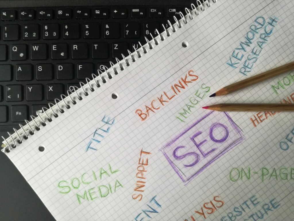 Social Media Marketing for Restaurants: 15 Tips With Examples Close-up of notebook with SEO terms and keywords, highlighting digital marketing strategy.